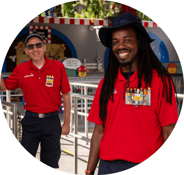 Two legoland employees smiling